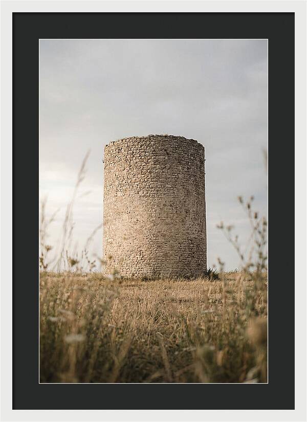 Cylindrical Stone Tower In Field
