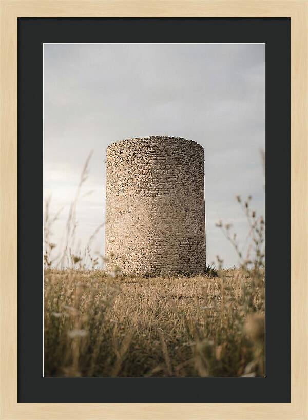 Cylindrical Stone Tower In Field