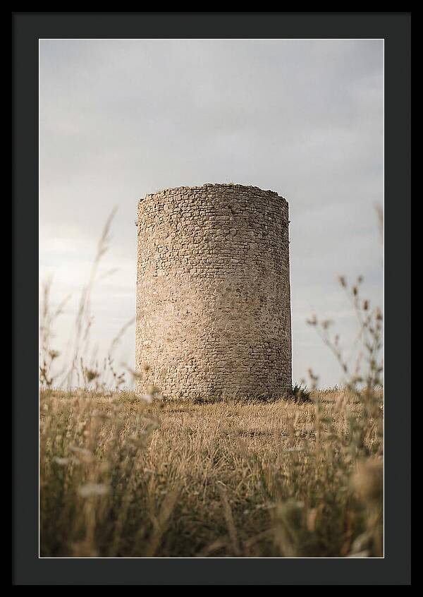 Cylindrical Stone Tower In Field