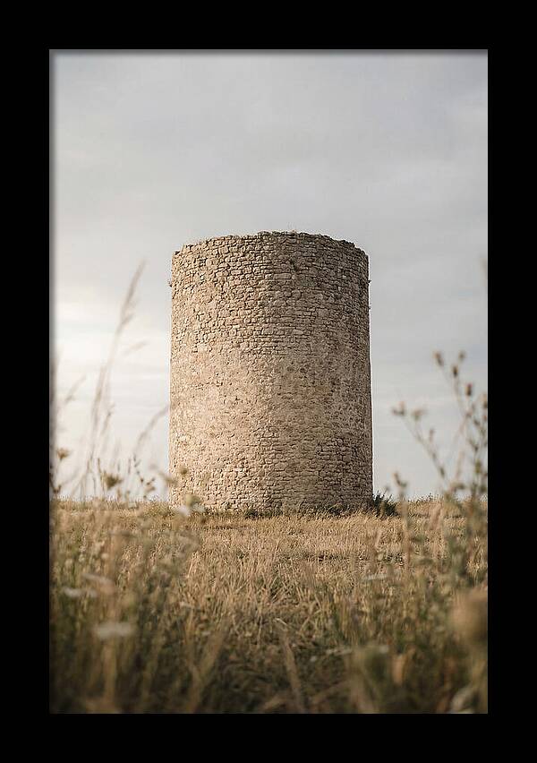 Cylindrical Stone Tower In Field
