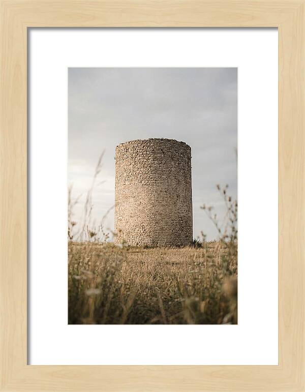 Cylindrical Stone Tower In Field