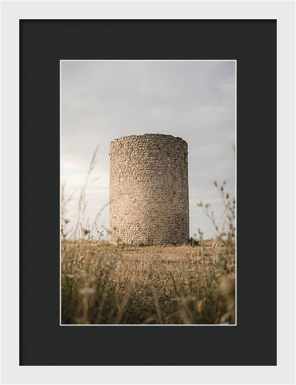 Cylindrical Stone Tower In Field