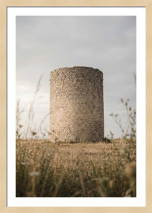 Cylindrical Stone Tower In Field