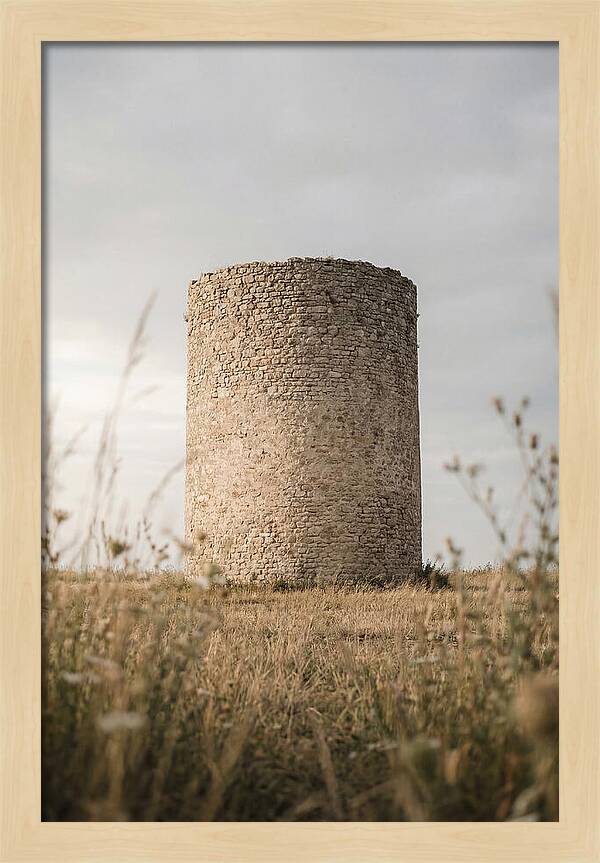 Cylindrical Stone Tower In Field