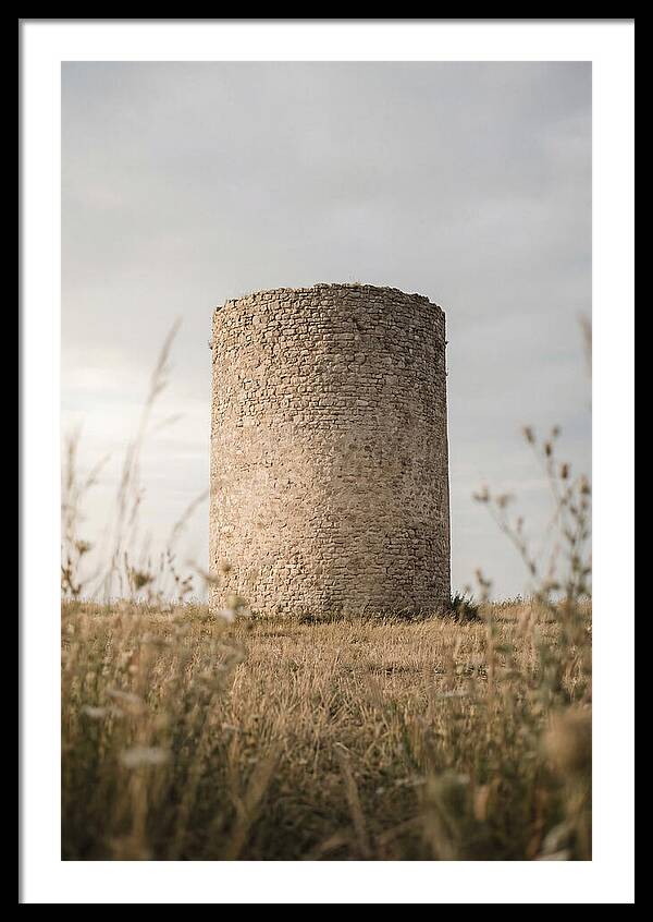 Cylindrical Stone Tower In Field