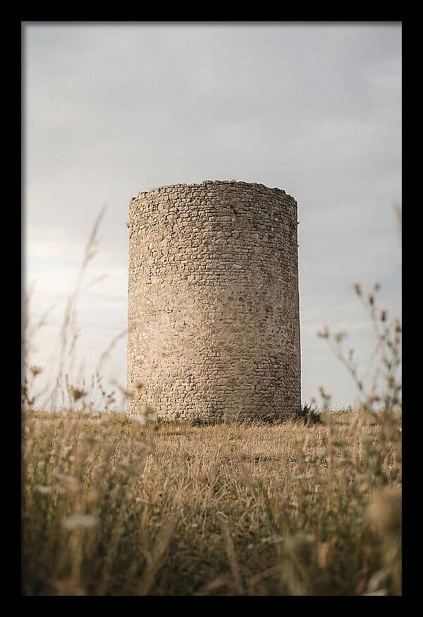 Cylindrical Stone Tower In Field
