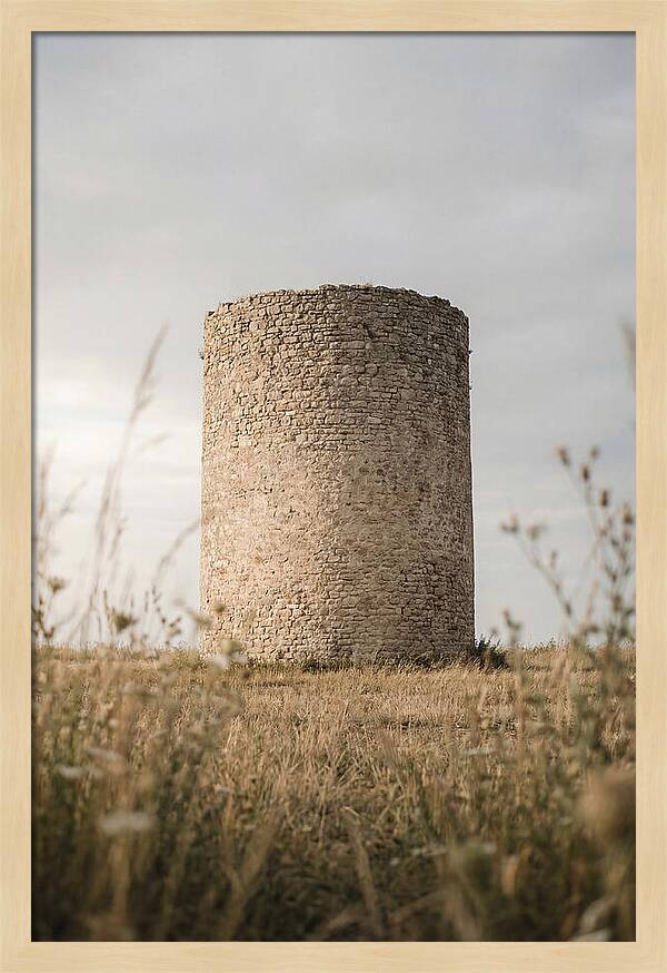 Cylindrical Stone Tower In Field