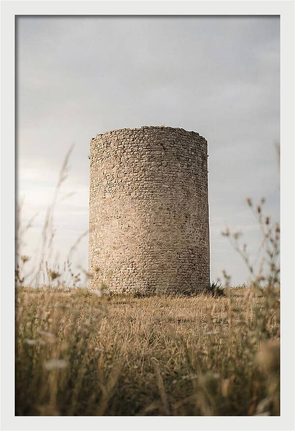 Cylindrical Stone Tower In Field