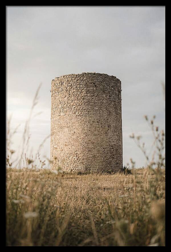 Cylindrical Stone Tower In Field