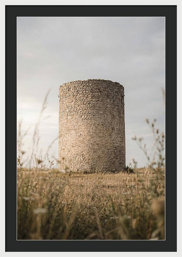 Cylindrical Stone Tower In Field