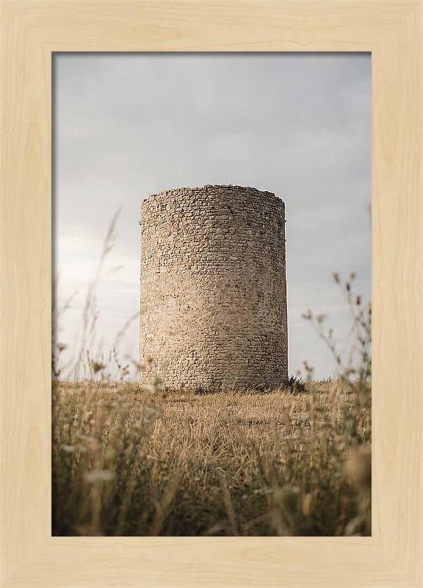 Cylindrical Stone Tower In Field