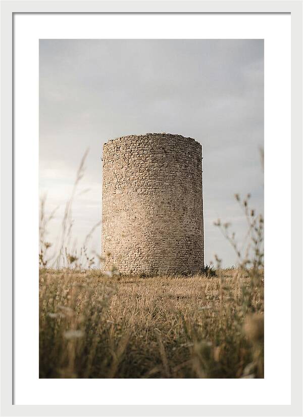 Cylindrical Stone Tower In Field