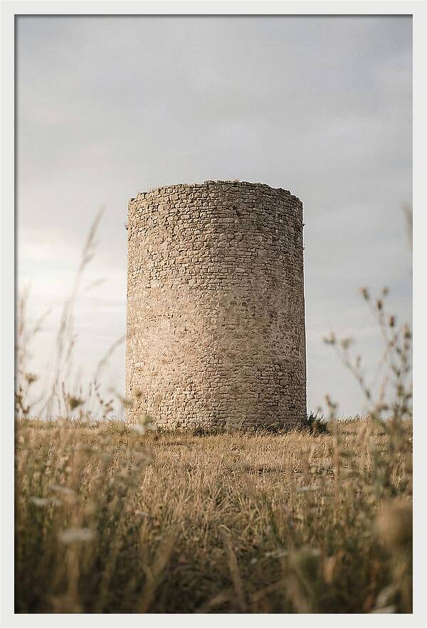 Cylindrical Stone Tower In Field