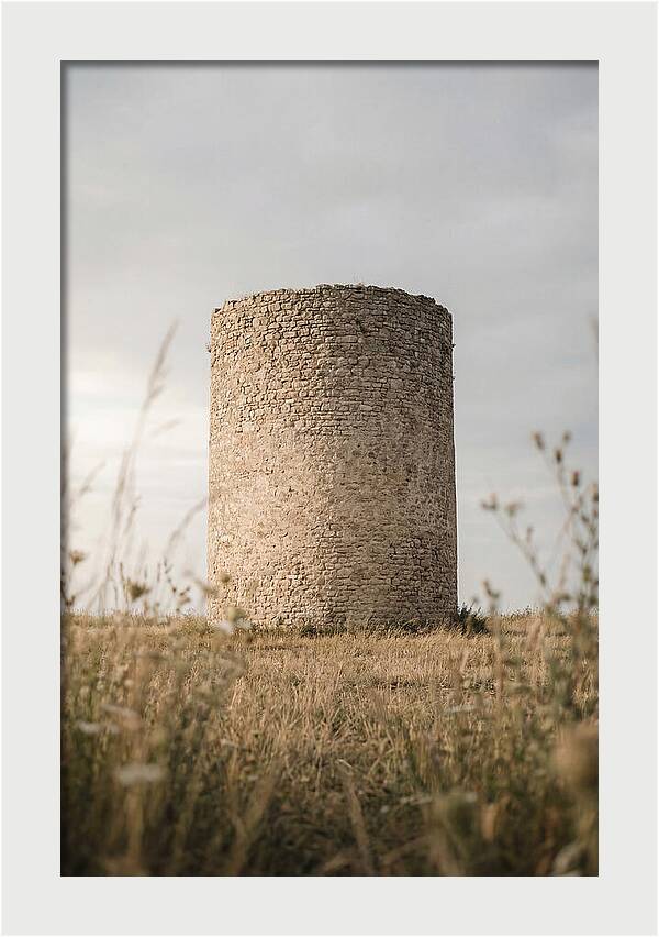 Cylindrical Stone Tower In Field