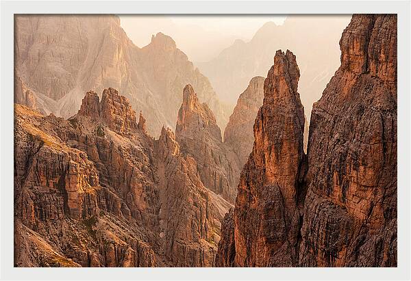 Dolomite Spires Bathed In Golden Light