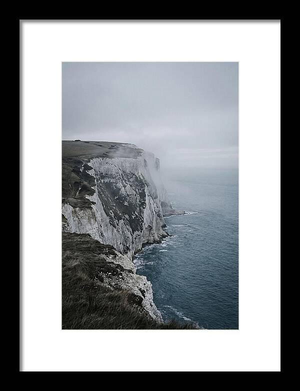 Dramatic Cliffs Under Cloudy Skies
