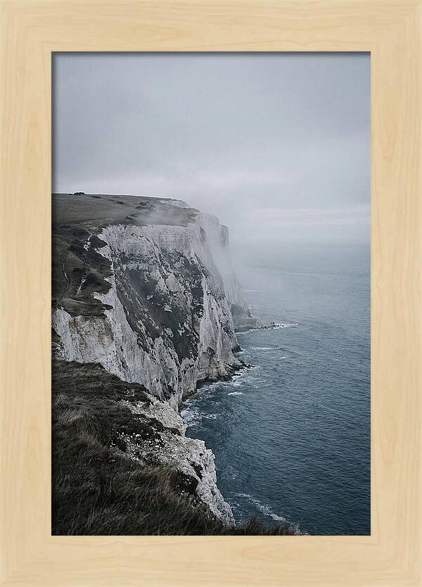 Dramatic Cliffs Under Cloudy Skies