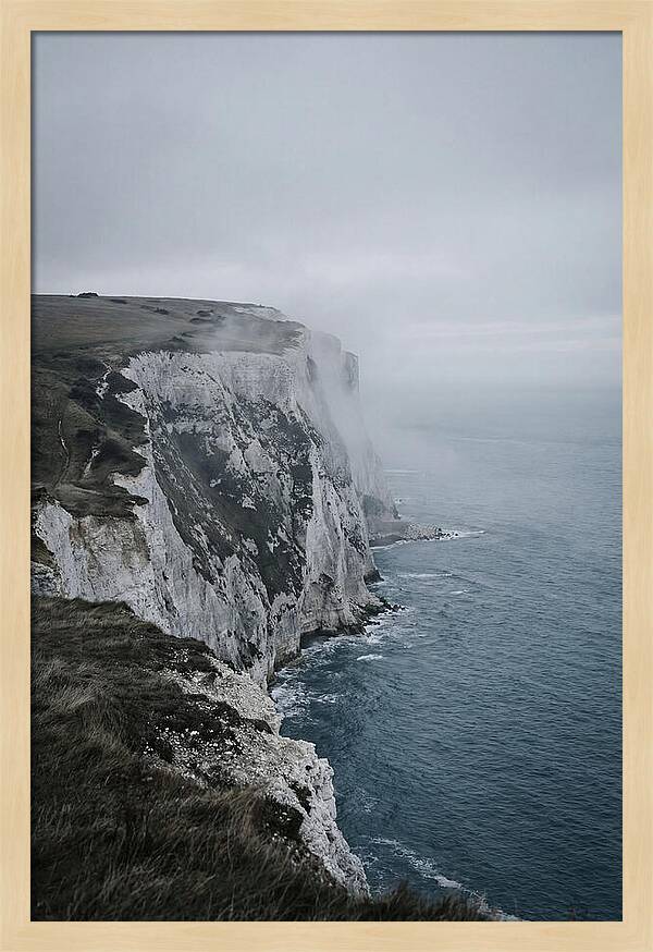 Dramatic Cliffs Under Cloudy Skies