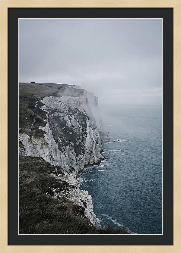 Dramatic Cliffs Under Cloudy Skies