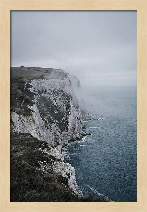 Dramatic Cliffs Under Cloudy Skies
