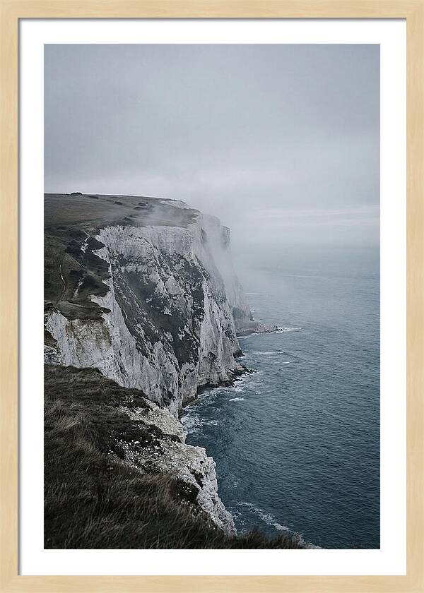 Dramatic Cliffs Under Cloudy Skies
