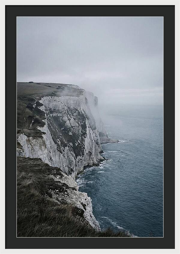 Dramatic Cliffs Under Cloudy Skies