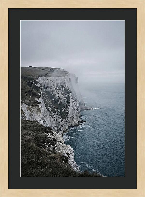 Dramatic Cliffs Under Cloudy Skies