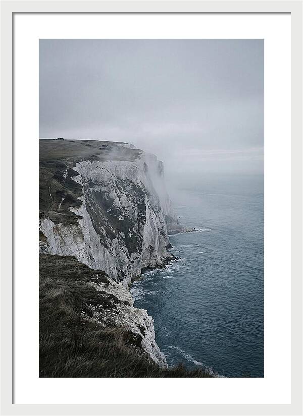 Dramatic Cliffs Under Cloudy Skies