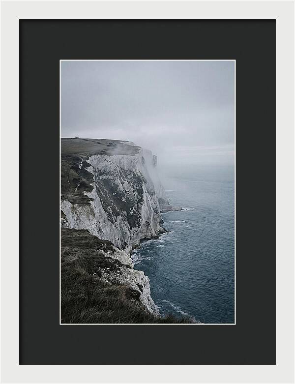 Dramatic Cliffs Under Cloudy Skies