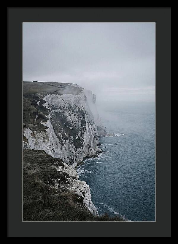 Dramatic Cliffs Under Cloudy Skies
