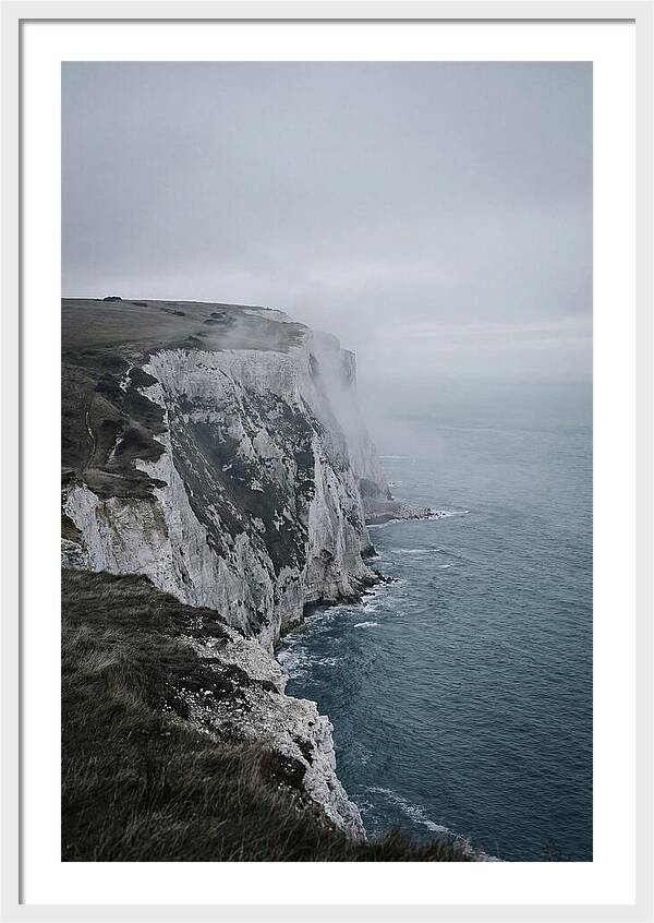 Dramatic Cliffs Under Cloudy Skies