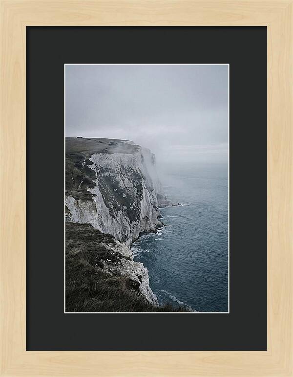 Dramatic Cliffs Under Cloudy Skies