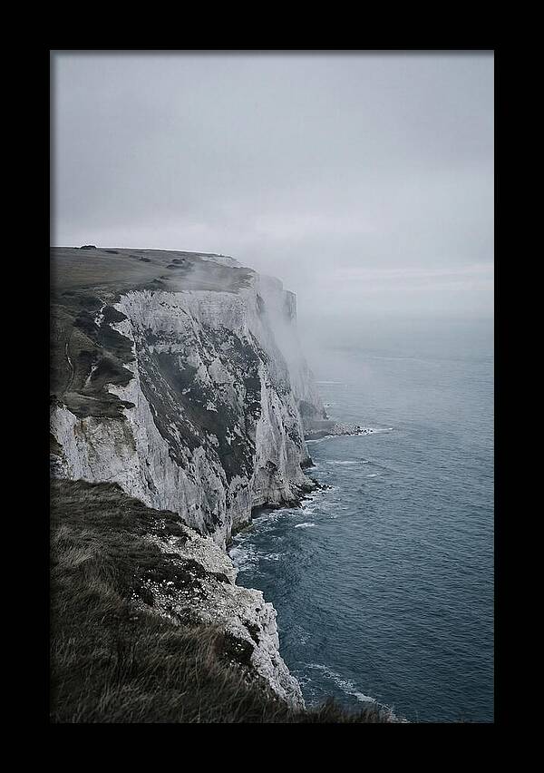 Dramatic Cliffs Under Cloudy Skies