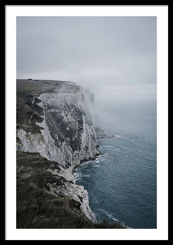 Dramatic Cliffs Under Cloudy Skies