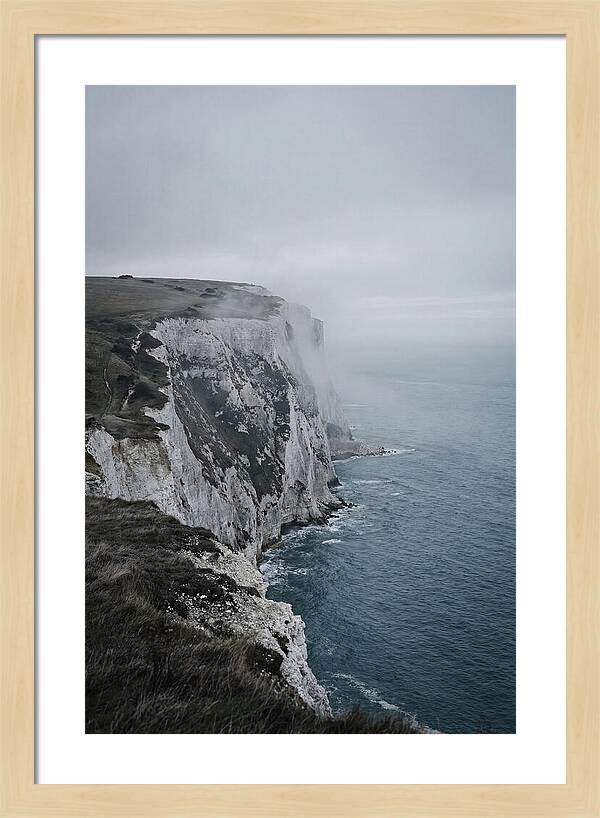 Dramatic Cliffs Under Cloudy Skies