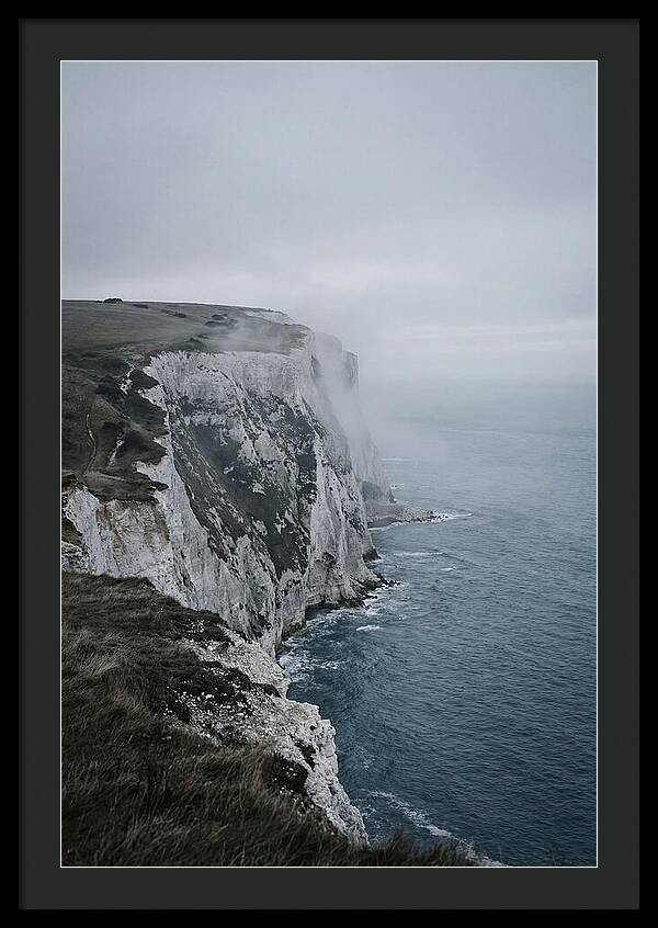 Dramatic Cliffs Under Cloudy Skies