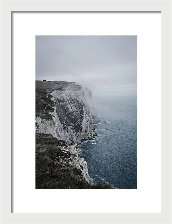 Dramatic Cliffs Under Cloudy Skies
