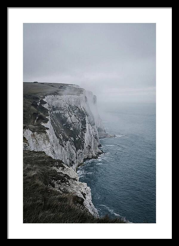 Dramatic Cliffs Under Cloudy Skies