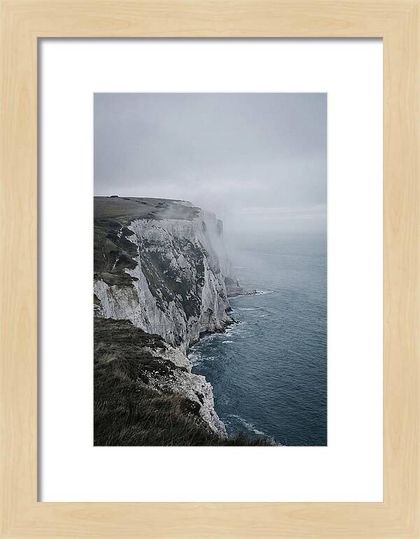 Dramatic Cliffs Under Cloudy Skies
