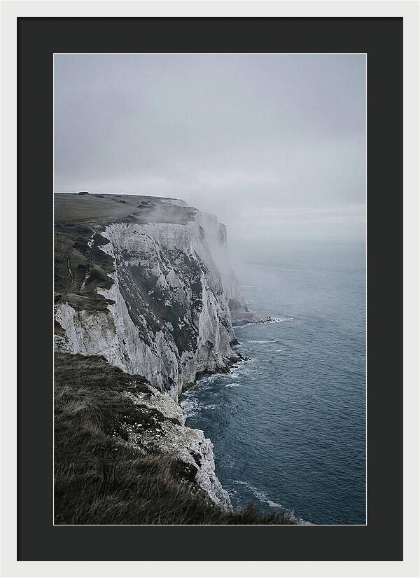Dramatic Cliffs Under Cloudy Skies