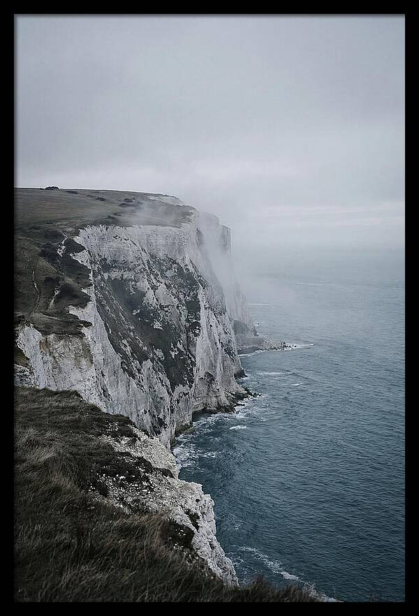 Dramatic Cliffs Under Cloudy Skies