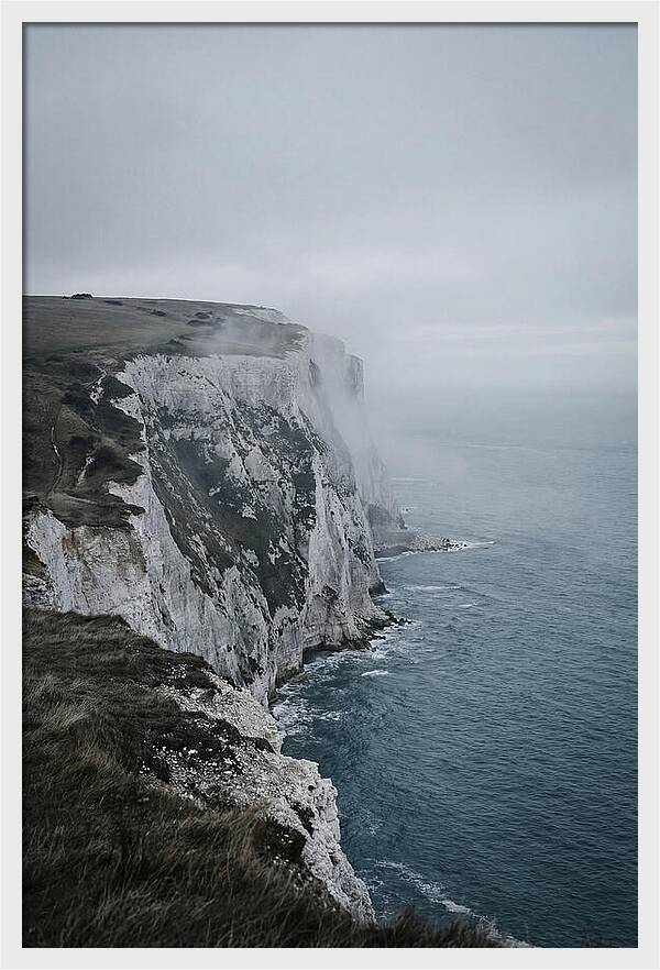 Dramatic Cliffs Under Cloudy Skies