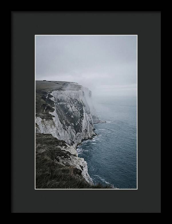 Dramatic Cliffs Under Cloudy Skies