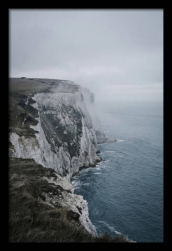 Dramatic Cliffs Under Cloudy Skies