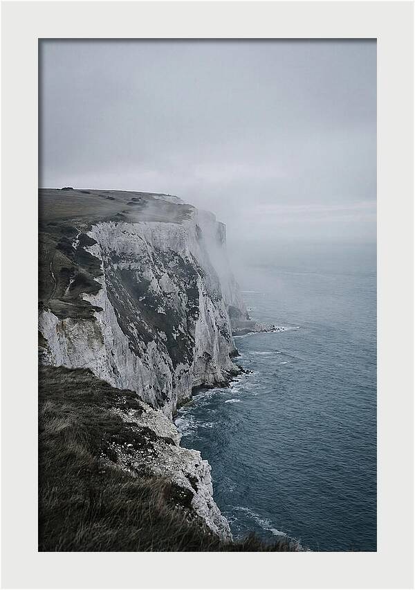 Dramatic Cliffs Under Cloudy Skies