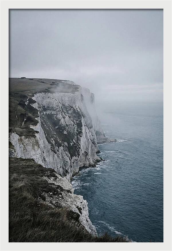 Dramatic Cliffs Under Cloudy Skies