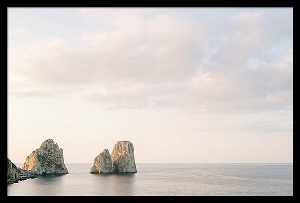 Dramatic Dusk Over Faraglioni Stacks