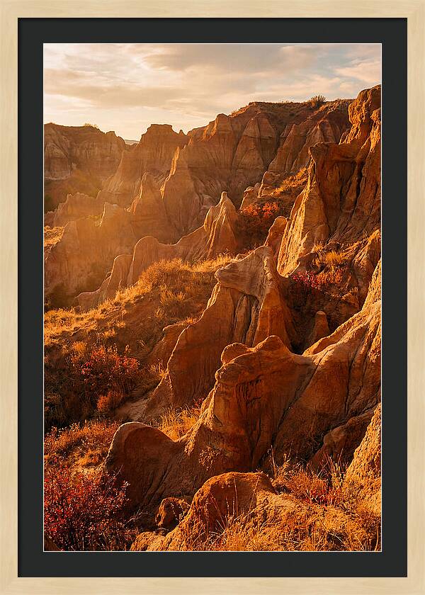Eroded Mudstone Formations At Sunset