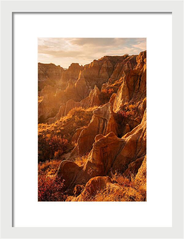 Eroded Mudstone Formations At Sunset