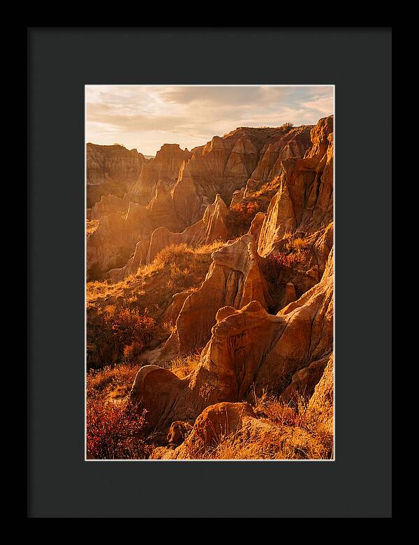 Eroded Mudstone Formations At Sunset